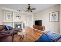 Inviting living room with a fireplace and gleaming hardwood floors, perfect for relaxation at 3734 Ridgeway St, Boulder, CO 80301