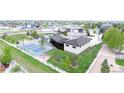 The home's exterior features a basketball court, pool, and meticulously maintained landscaping at 2635 Spruce Meadows Dr, Broomfield, CO 80023