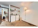 Functional laundry room with washer, dryer, and ample storage space at 4162 S Dunkirk Way, Aurora, CO 80013