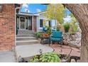 Home exterior featuring landscaped yard, seating area, and inviting entrance with steps at 87 Prairie Ridge Rd, Highlands Ranch, CO 80126