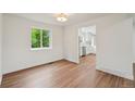 Bright dining room with hardwood floors, a new window, and updated light fixture at 5882 W 109Th Ave, Westminster, CO 80020