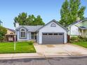 Well-kept single-Gathering home featuring a 2-car garage, tidy lawn, and inviting front entrance at 12646 Osceola St, Broomfield, CO 80020