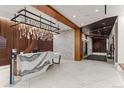 Modern lobby features a marble reception desk, contemporary lighting, and sleek wooden paneling, creating a sophisticated ambiance at 1901 Wazee St # 419, Denver, CO 80202