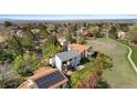 Scenic aerial view of the property showcasing the neighborhood, trees, and the home's exterior at 3620 Silver Plume Ln, Boulder, CO 80305