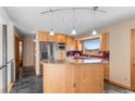Bright kitchen featuring granite countertops, stainless steel appliances, and a functional layout at 3620 Silver Plume Ln, Boulder, CO 80305