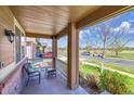 Relaxing covered front porch with seating and a view of the street at 25262 E 2Nd Pl, Aurora, CO 80018