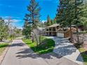 Beautiful two-story home with an attached two car garage and gorgeous curb appeal on a sunny day at 7134 Kiowa Rd, Larkspur, CO 80118