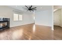 Living room with hardwood floors and a fireplace at 1405 Willow Oak Rd, Castle Rock, CO 80104