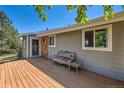 Home exterior featuring wooden deck with seating at 1817 Buttercup Rd, Elizabeth, CO 80107