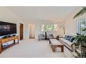 Inviting living room with plush carpet and natural light at 1817 Buttercup Rd, Elizabeth, CO 80107