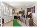 Office area with wood-look flooring, large window with bright light, desk and decor at 2576 Villageview Ln, Castle Rock, CO 80104