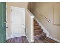 Bright foyer featuring modern flooring, white trim and doors, and easy access to the stairs at 1194 Red Lodge Dr # 201, Evergreen, CO 80439