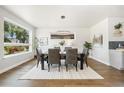 Inviting dining room features hardwood floors, ample natural light, and stylish furnishings for comfortable meals at 2010 Irving St, Denver, CO 80211