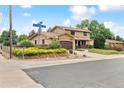 Charming two-story home with a well-manicured lawn and inviting curb appeal on a corner lot at 8588 E Costilla Ave, Centennial, CO 80112