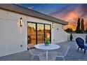 Relaxing roof deck with a white table and chairs, perfect for enjoying outdoor meals and sunset views at 1374 S Vine St, Denver, CO 80210