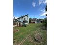 Large backyard with playset, shed, garden, and fencing, providing ample space for outdoor activities and relaxation at 4362 Denmark Ct, Denver, CO 80239
