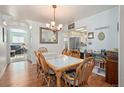 Cozy dining room area with hardwood floors, tiled dining table, and natural light at 8501 W 52Nd Ave, Arvada, CO 80002