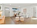Bright living room boasts hardwood floors, stylish furniture, and a cozy atmosphere at 211 Newport St, Denver, CO 80220