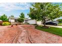 Charming home with a unique xeriscaped front yard, mature trees, and a welcoming two-car garage at 4520 E 112Th Pl, Thornton, CO 80233