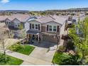 A vibrant neighborhood with mature trees and manicured lawns at 2410 Morningview Ln, Castle Rock, CO 80109