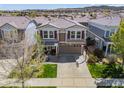 An aerial view of the exterior of the home in a vibrant, residential neighborhood at 2410 Morningview Ln, Castle Rock, CO 80109