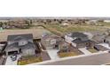 Aerial view of the community showcasing homes with manicured lawns and neighborhood streets at 14651 Dahlia Way, Thornton, CO 80602