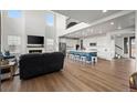 Bright, open living space with fireplace, hardwood floors and adjacent kitchen at 14651 Dahlia Way, Thornton, CO 80602