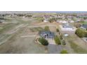 Expansive aerial view of property featuring large fenced yard perfect for horses and other animals at 8700 Ehler Pkwy, Brighton, CO 80602