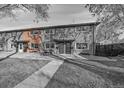 Brick townhouse exterior with private entrance and small front yard at 3734 Miller Ct, Wheat Ridge, CO 80033