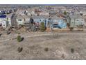 View of suburban homes backing to a natural area with walking path at 15972 E Tall Timber Ln, Parker, CO 80134