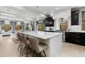 Bright, open kitchen with a large island, modern appliances, and stylish pendant lighting at 1815 Avery Way, Castle Rock, CO 80109