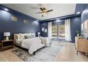 Cozy main bedroom retreat with tray ceilings, accent wall, ample natural light, and carpet floors at 1815 Avery Way, Castle Rock, CO 80109