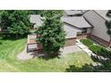 Aerial view of the home showcasing its well-maintained lawn, trees and back deck at 1006 Homestake Dr # 1D, Golden, CO 80401