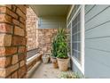 Charming balcony with stone accents, providing a cozy outdoor space with potted plants and seating at 457 Black Feather Loop # 702, Castle Rock, CO 80104