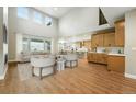 Bright, open-concept living room with hardwood floors, modern furniture, and plenty of natural light at 3370 Backdrop Ct, Castle Rock, CO 80108