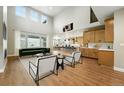 Bright living room with modern furniture, hardwood floors, and large windows allowing for ample natural light at 3370 Backdrop Ct, Castle Rock, CO 80108