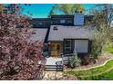 Beautiful exterior showcasing a welcoming entrance with a charming deck and well-maintained landscaping at 8277 Carriage Ln, Parker, CO 80134
