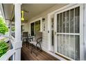 Cozy front porch featuring seating, an adorned security door, and a welcoming ambiance at 1372 S Cathay Ct # 104, Aurora, CO 80017