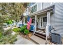 Charming front porch with a welcoming entrance and well-maintained landscaping at 1372 S Cathay Ct # 104, Aurora, CO 80017
