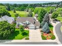 Areal view of a two story home surrounded by a well manicured lawn at 20829 Parliament Ct, Parker, CO 80138