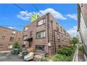 A multi-story brick apartment building showcases a practical and functional design at 1977 S Josephine St # 101, Denver, CO 80210