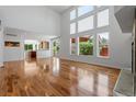 Spacious living room with hardwood floors open to kitchen with granite countertop at 14325 N Santa Fe St, Broomfield, CO 80023