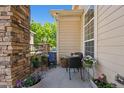 Cozy patio with stone pillars, outdoor furniture, and potted flowers, perfect for relaxing at 3742 E 127Th Ln, Thornton, CO 80241