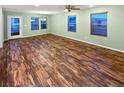 A well-lit living room features hardwood floors and neutral paint at 27699 E 7Th Ln, Aurora, CO 80018