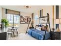 bedroom with teepee bed, western decor, and a view at 11053 Snowdon St, Parker, CO 80134