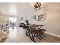 Cozy living area with dining space featuring a fireplace and natural light at 8264 S Fillmore Way, Centennial, CO 80122