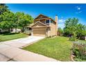 A well maintained single Gathering house featuring a lawn, front porch, and attached garage at 19706 E Bellewood Dr, Centennial, CO 80015