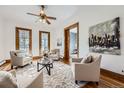 Inviting living room featuring comfortable seating, stylish decor, and an open ambiance that flows to a room beyond at 1284 N Corona St # B6, Denver, CO 80218
