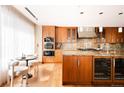 Spacious kitchen with stainless steel appliances, granite countertops, and wine cooler at 1133 14Th St # 3420, Denver, CO 80202