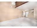 Bright living room with high ceilings, a staircase, and lots of natural light at 2141 S Victor St # B, Aurora, CO 80014